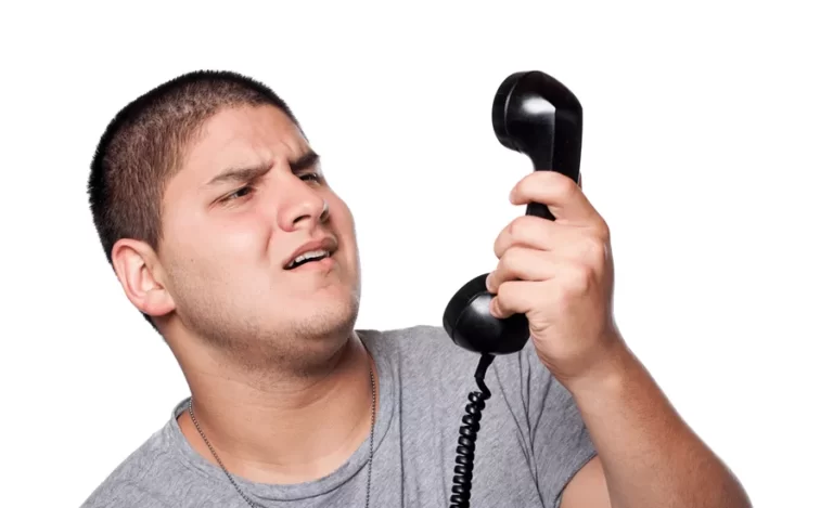 Xan angry and irritated young man yells into the telephone receiver over a white background HYGxIsvCBi crop.png.pagespeed.ic .1aKPf6DZsF